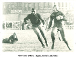 Duke Slater of the Iowa Hawkeyes chasing a ball carrier in a game around 1920