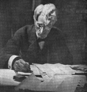 Kenesaw Mountain Landis writing on a piece of paper