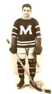 Charles Dinsmore standing in Montreal Maroons hockey uniform circa 1925