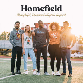 customers wearing homefield apparel shirts on a football field