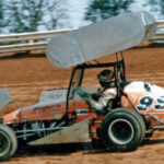 Jan Opperman driving a winged sprint car in the 1970's