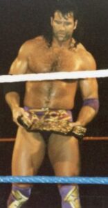 Scott Hall in his Razor Ramon gimmick, holding the WWF Tag Team Championship belt before failing to win it.
