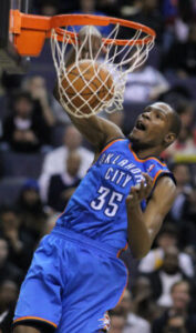 Kevin Durant with the Oklahoma City Thunder slam drunks during a game against the Washington Wizards on March 14, 2011.