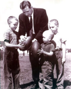 Jim Finks with children. Source via Jim Finks Foundation website.